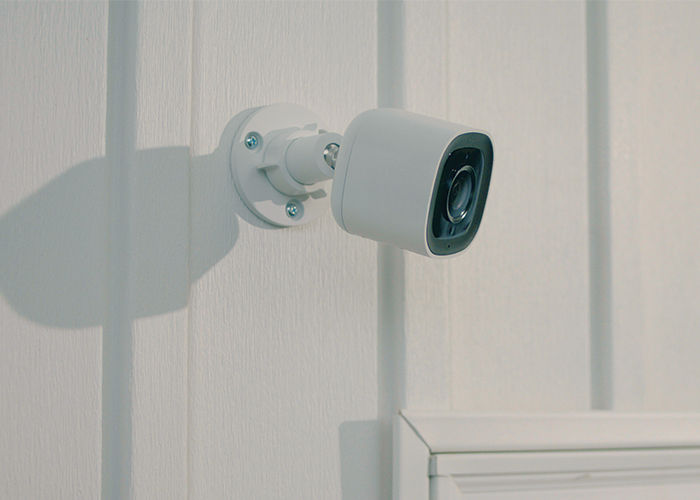 Guardian Protection outdoor security camera mounted on a home's exterior wall.