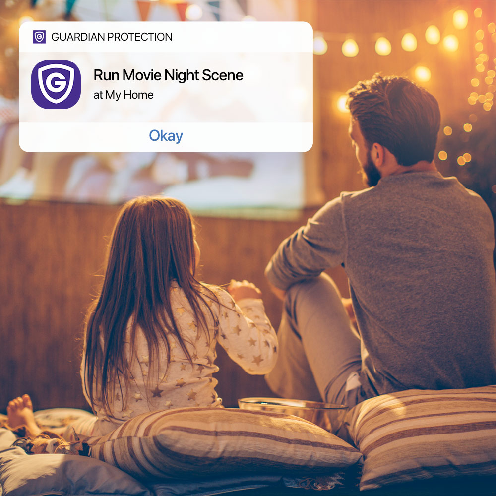 Father and daughter watching movie with Guardian app to show Movie Night Scene