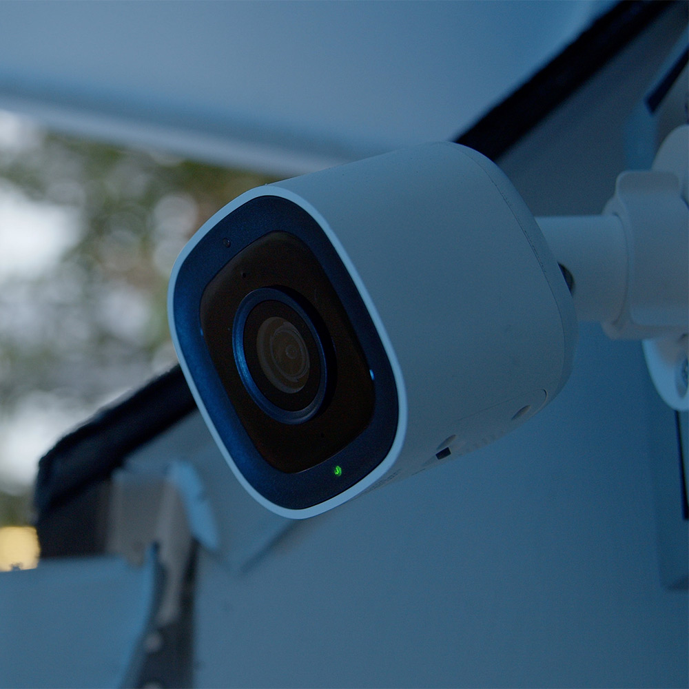 Guardian home security camera mounted on a white wall