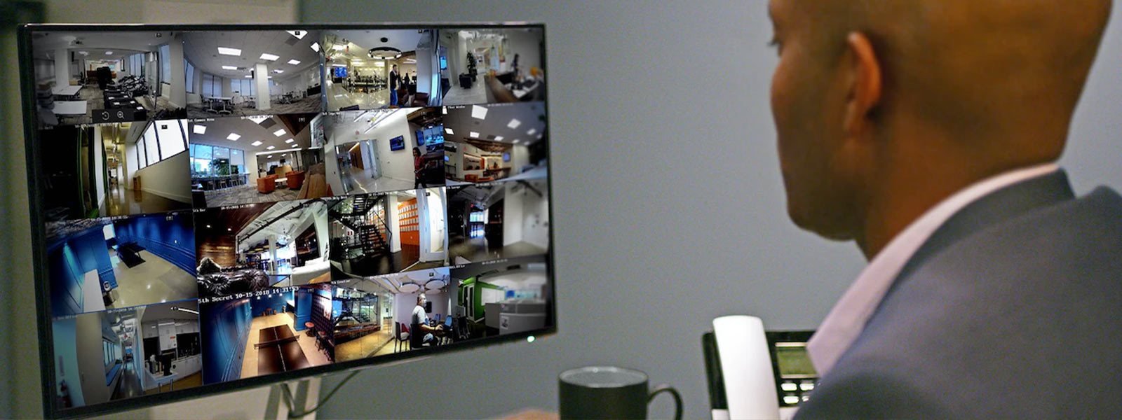 Feeds from Guardian Protection business security cameras on a desktop