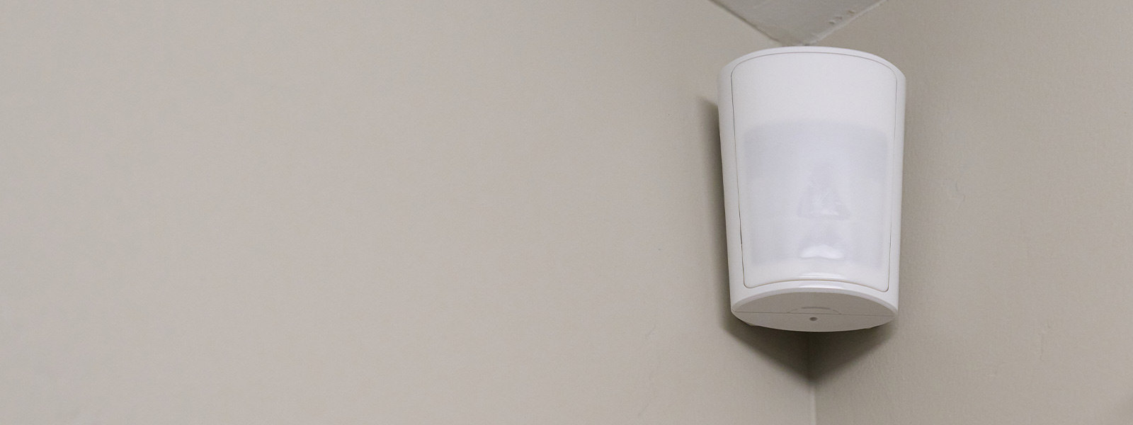 Guardian Protection motion sensor mounted on a wall