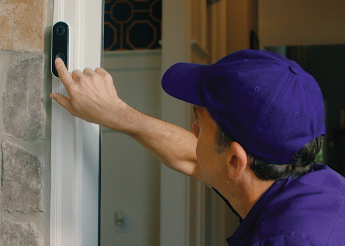 Guardian Protection technician installing a video doorbell 