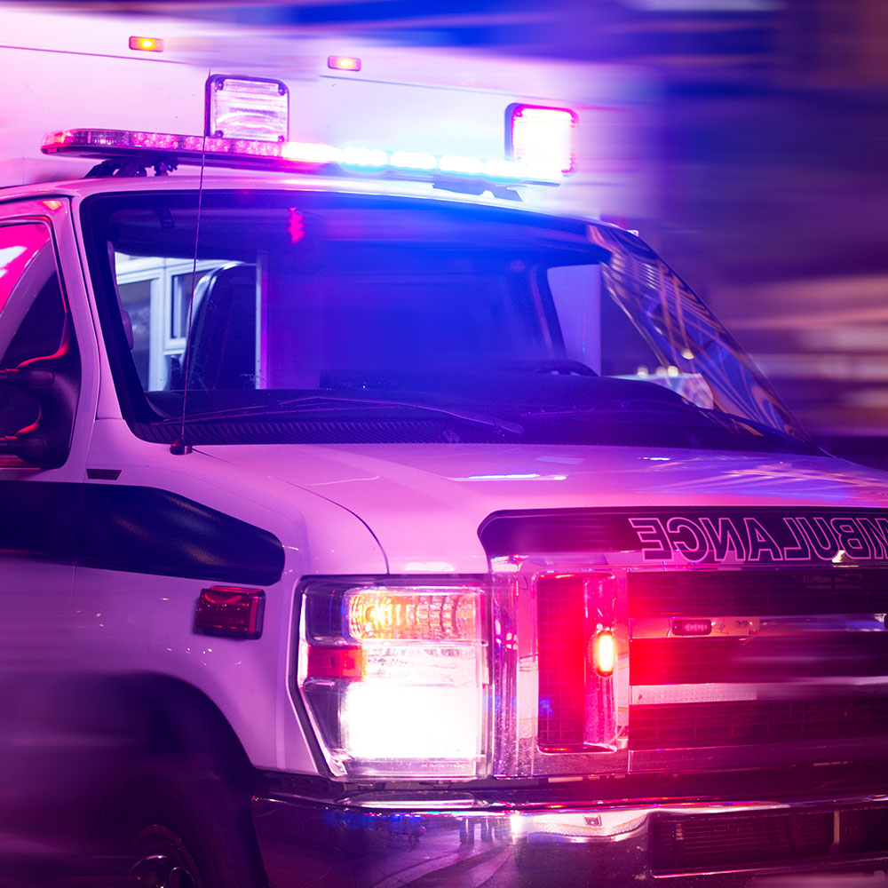 An ambulance with flashing red and blue lights
