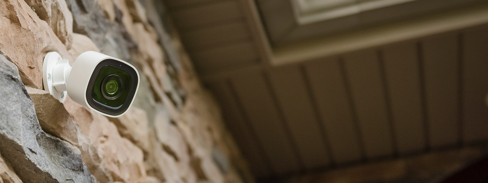 Guardian Protection outdoor camera on side of house