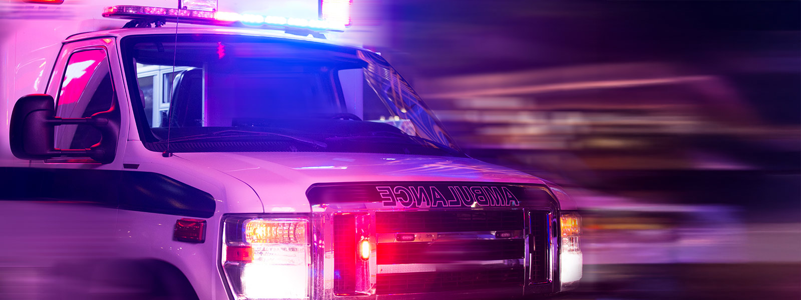 Ambulance with flashing red and blue lights