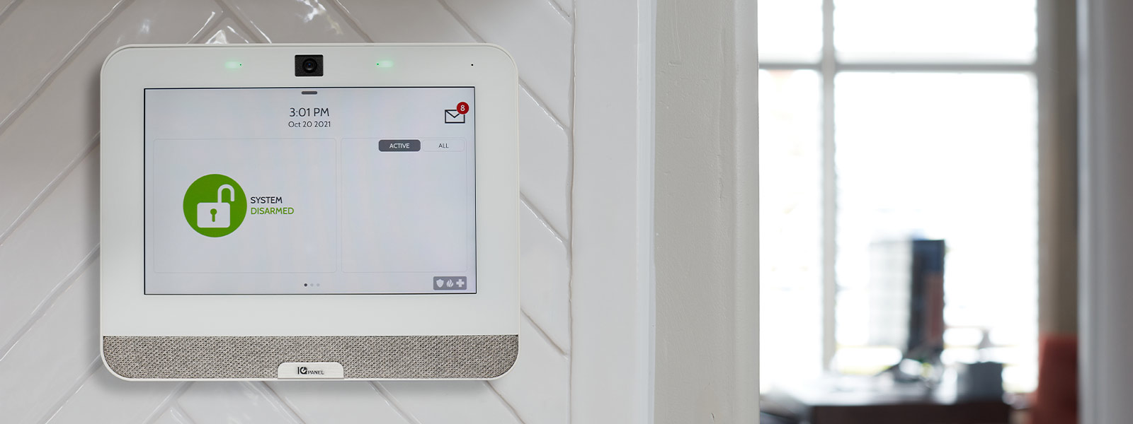 A Guardian Protection panel mounted on the wall showing the system is disarmed