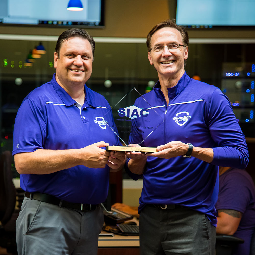 Guardian Protection President and Chief Operating Officer accepting award