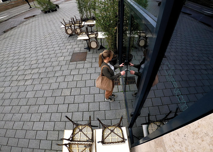 Woman locking up restaurant's front door