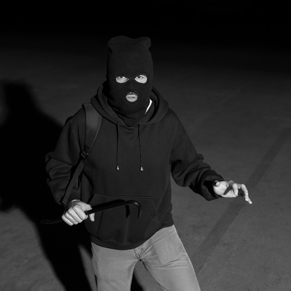 Burglar wearing face mask