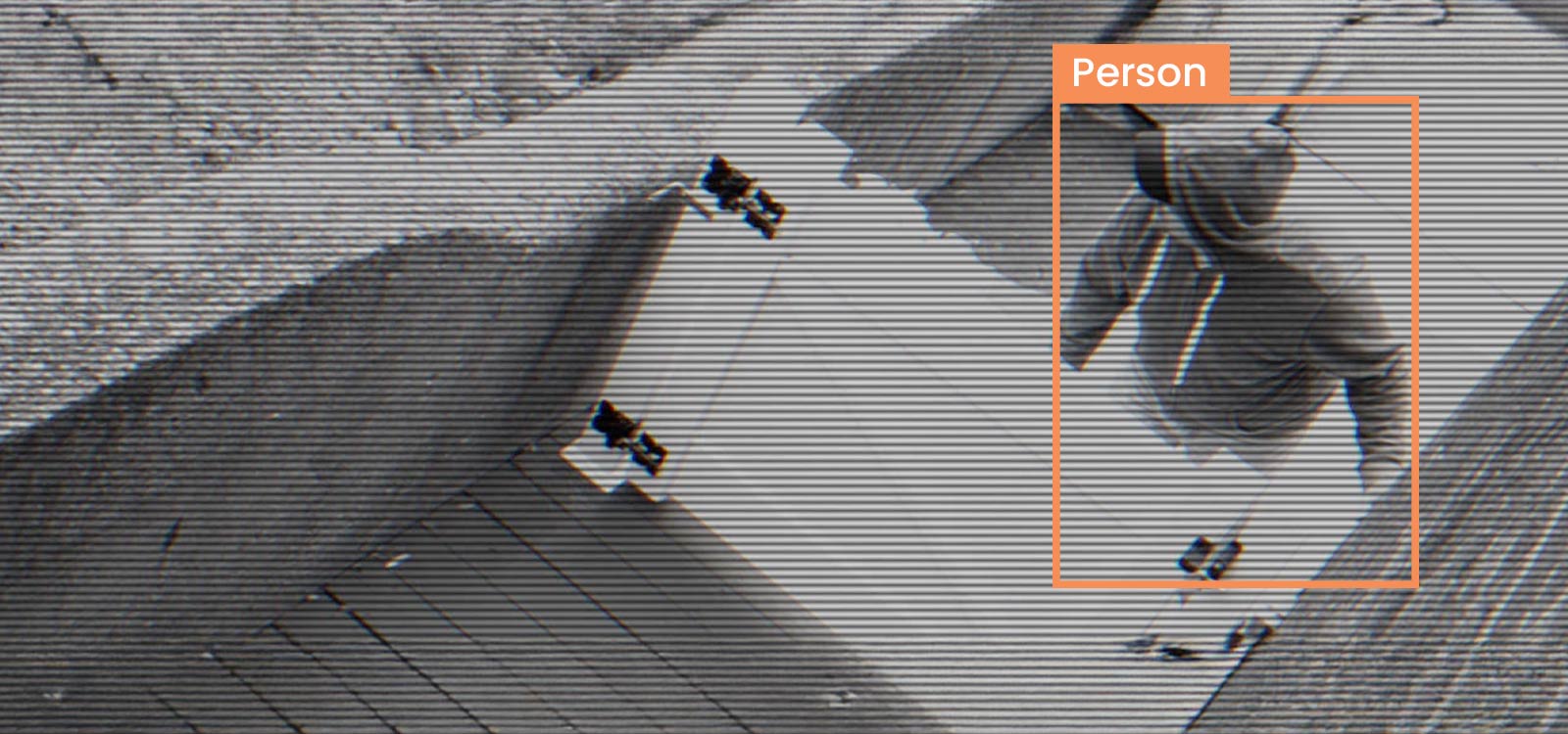 Black and white image of an intruder being detected by a Guardian Protection smart security camera