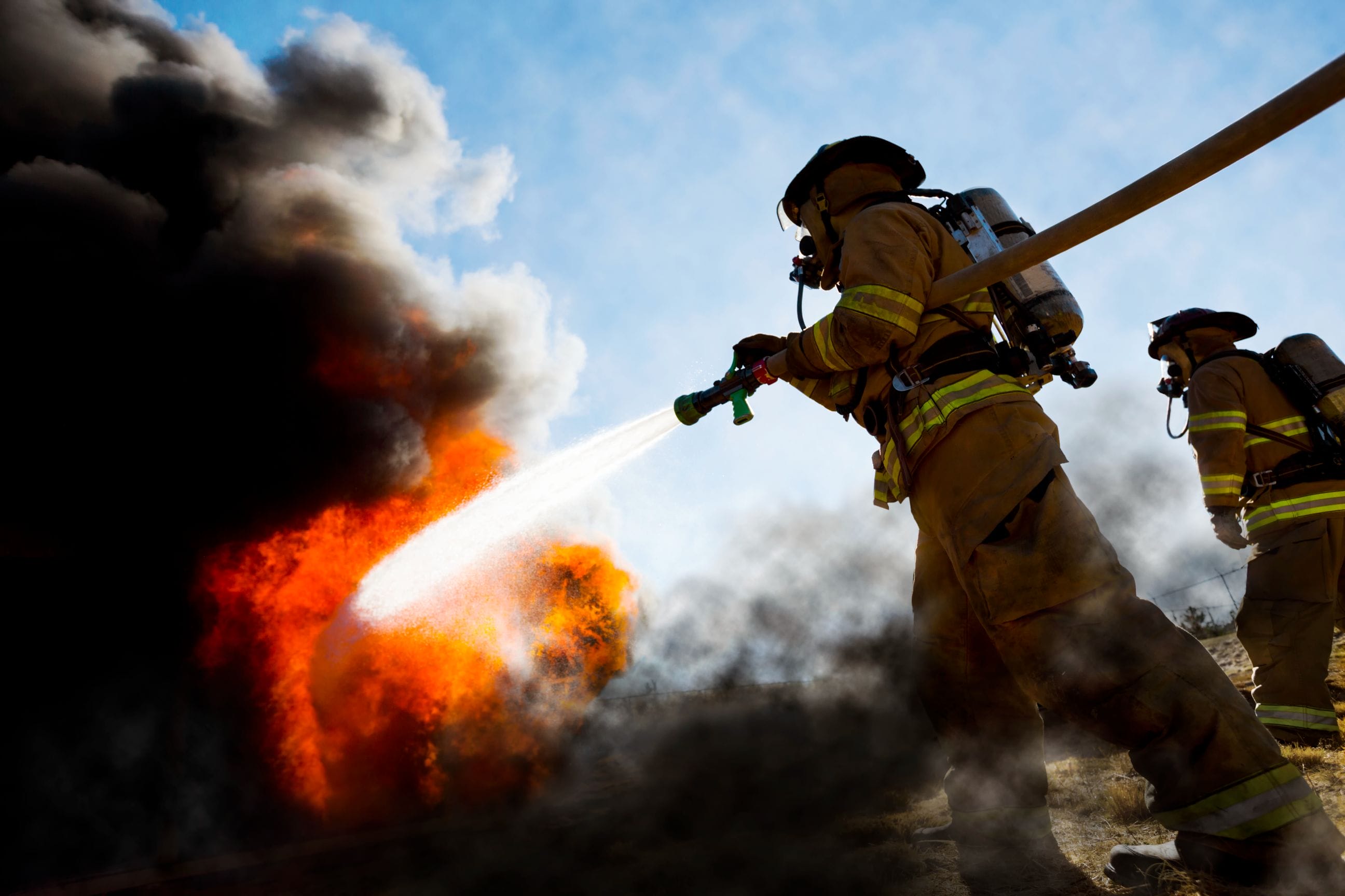 Firefighter putting out flames
