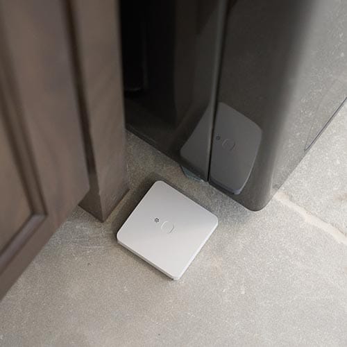 Guardian Protection Water & Freeze Sensor on bathroom floor